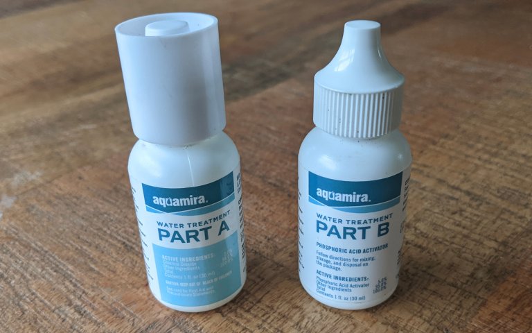 Aquamira bottles sitting on a table