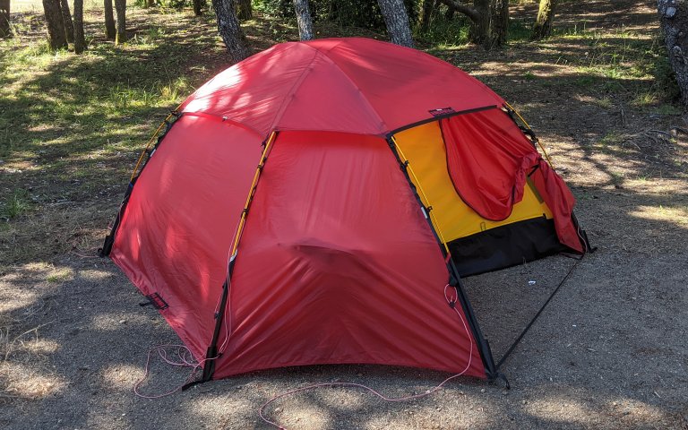 Hilleberg allak in a campground in dappled sunlight