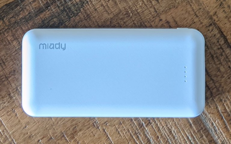 Miady power bank sitting on a wooden table