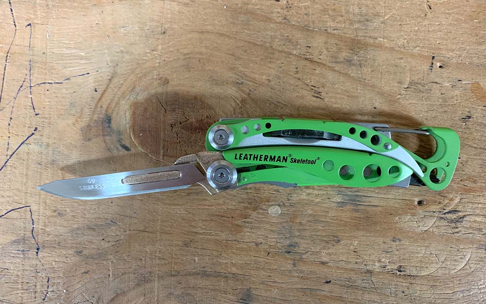 A leatherman with a replaceable blade scapel.