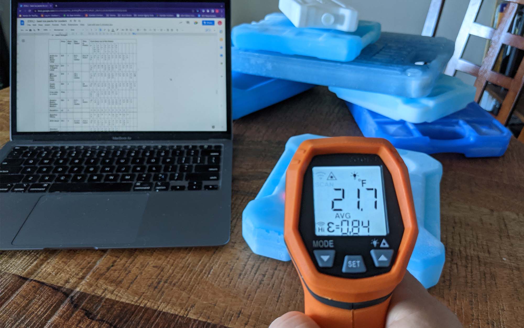Author using infrared thermometer to test best ice packs for coolers.