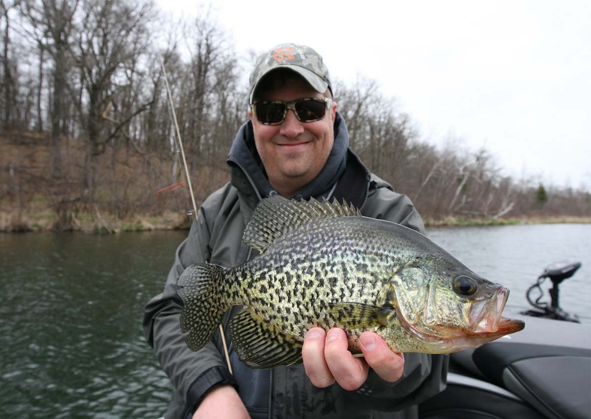 person holding fishing rod Rack Fishing a Popping Cork: 10