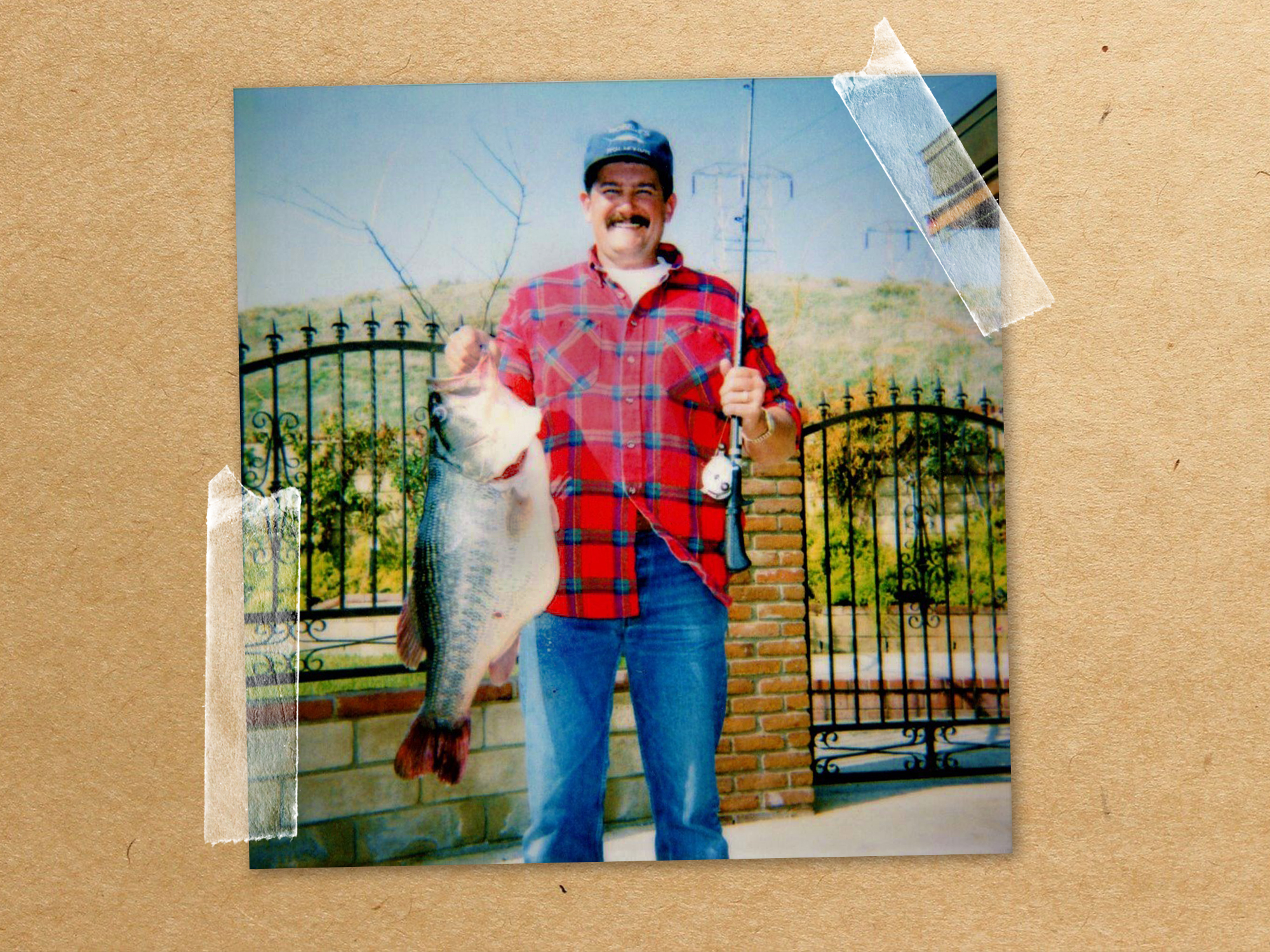 man with record bass and rod
