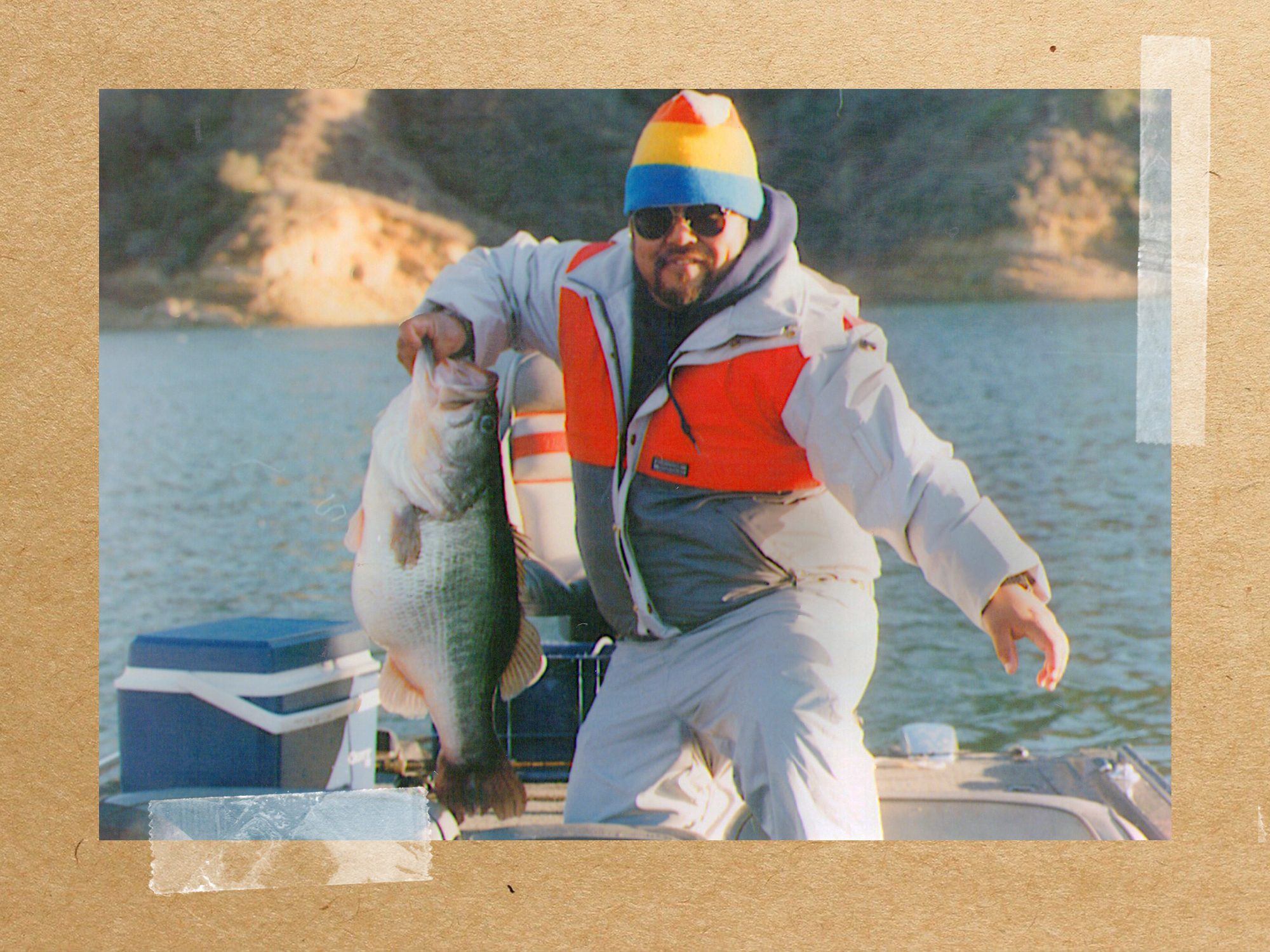 man in boat with record bass