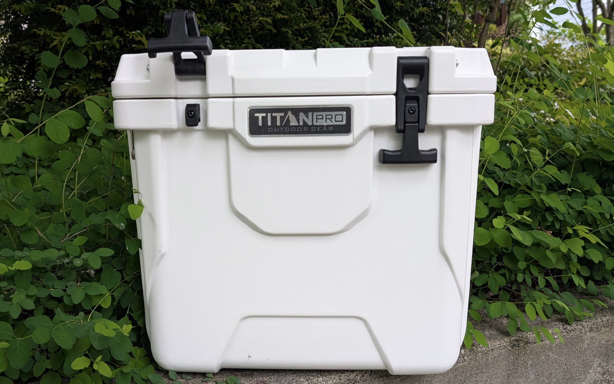 Titan Small Roto Cooler set against foliage