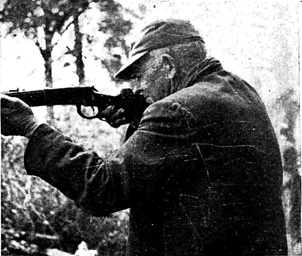 old magazine photo of hunter aiming gun