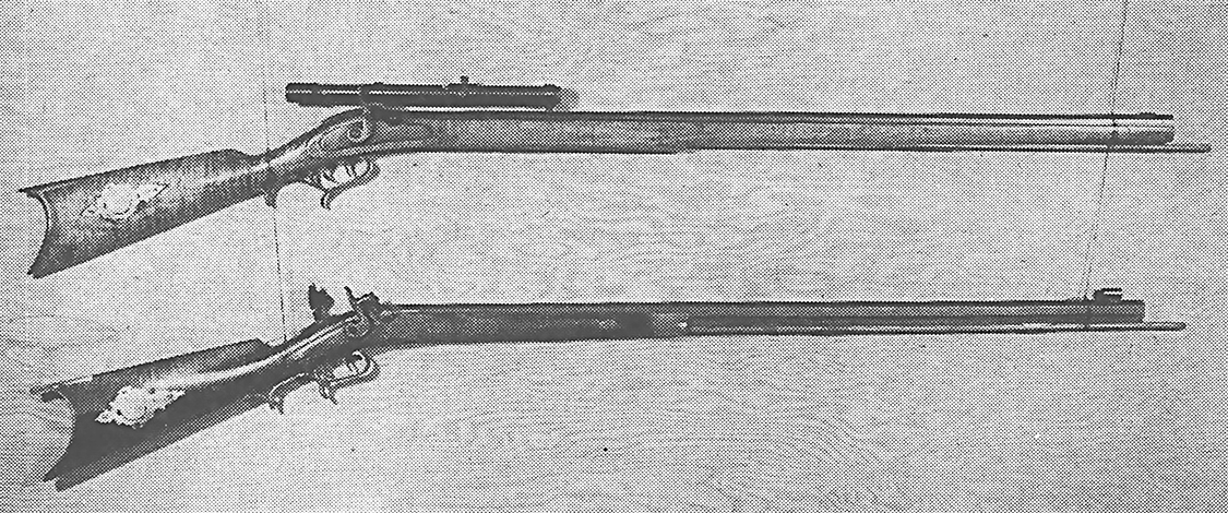 Two replica plains rifles in a bw photo.