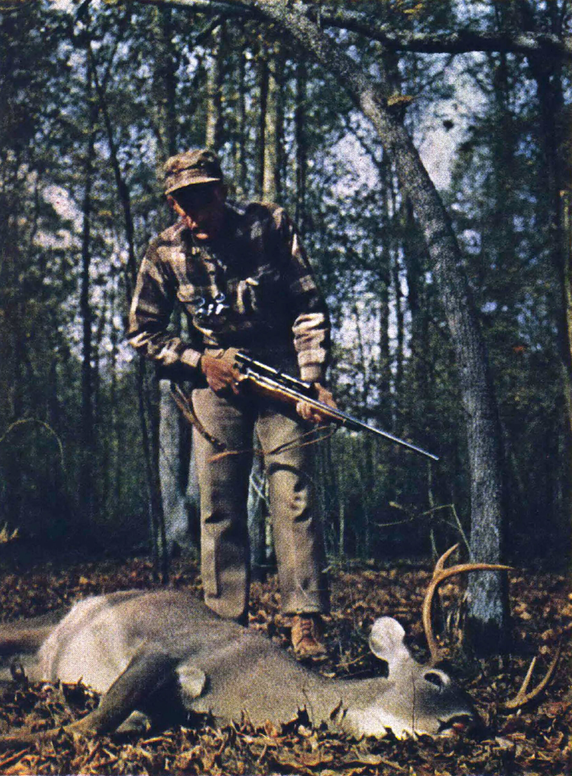 A hunter with a buck.