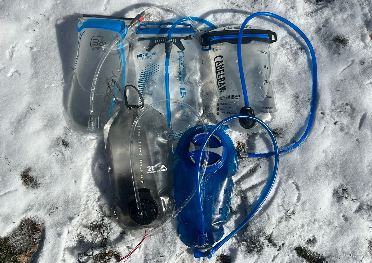 The best hydration bladders sit in the snow.