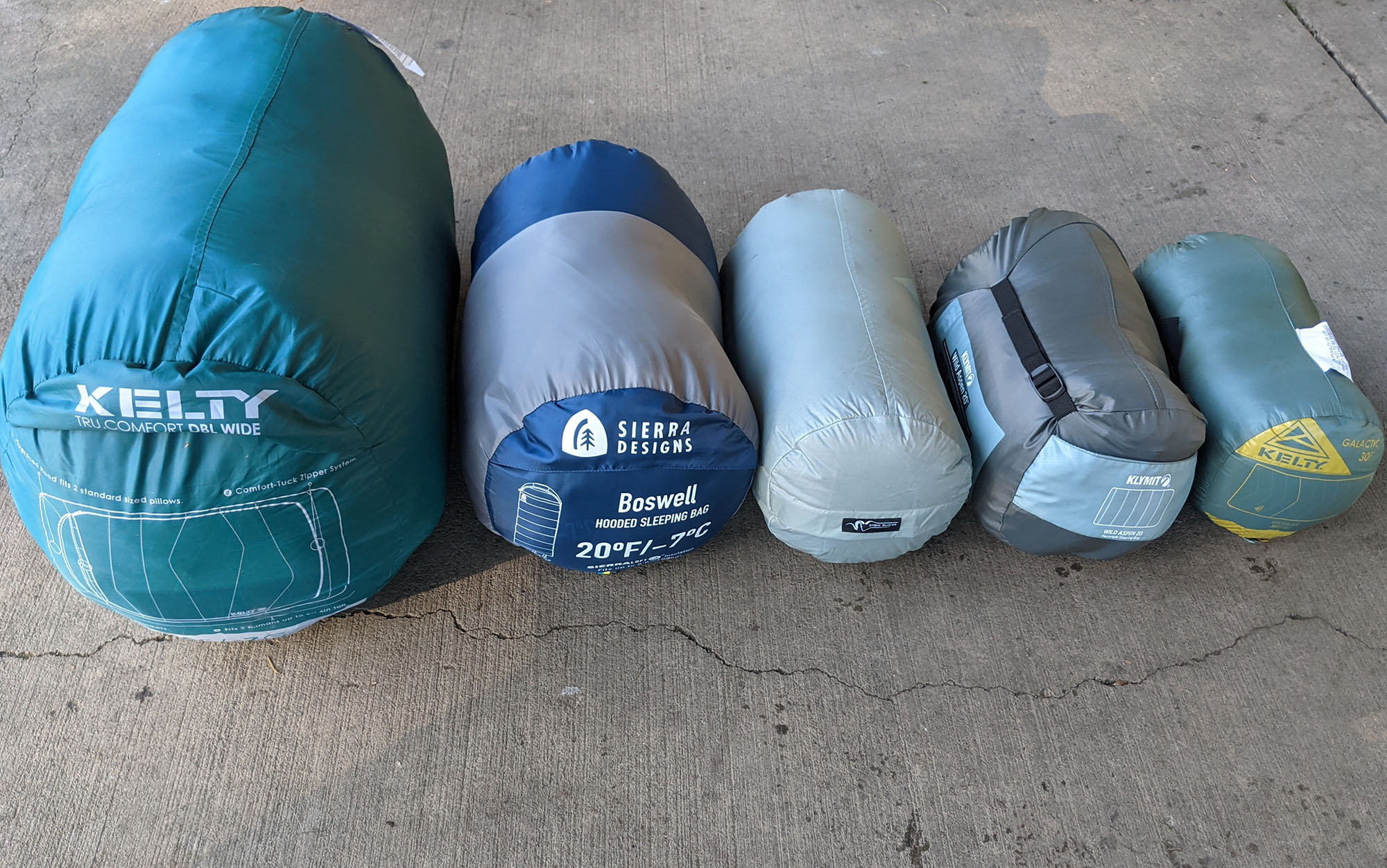 One major selling point of the Galactic 30 (far right) is its exceptionally small packed size. Also featured are the Kelty Tru Comfort Doublewide, Sierra Designs Boswell, Stone Glacier Chilkoot, and Klymit Wild Aspen Rectangle.