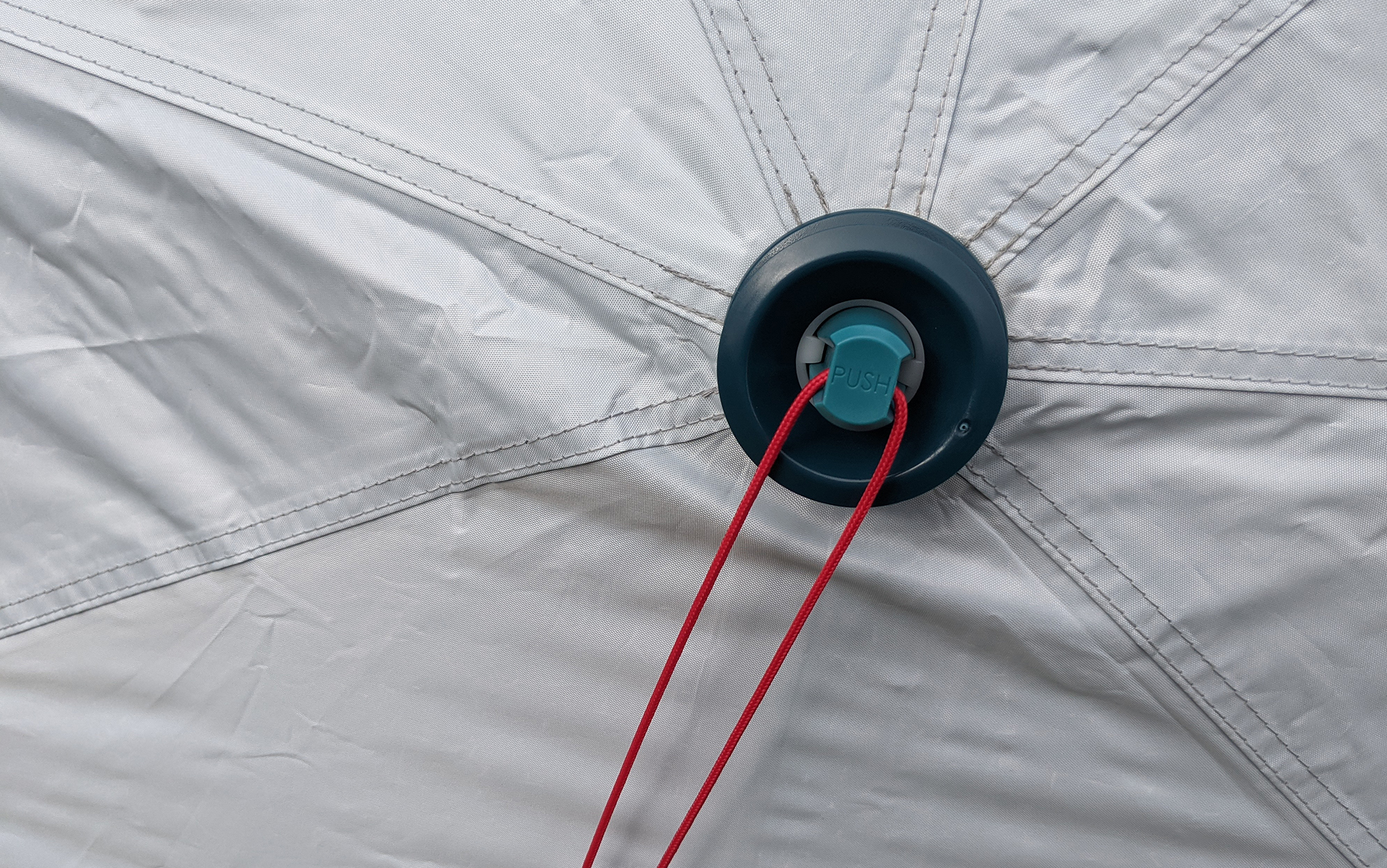 Pressing firmly on the blue button collapses the tent instantly, making for a surprisingly short tear-down time.