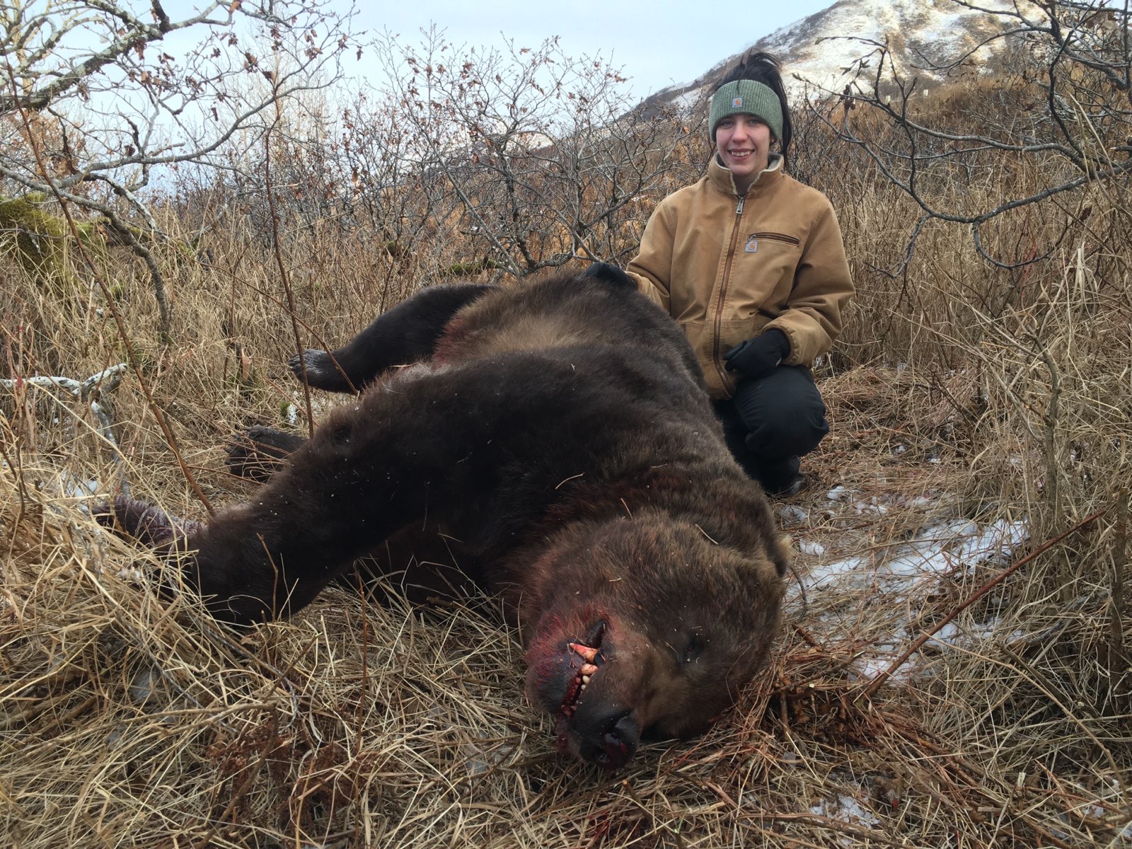 A 16-year-old brown bear hunter and her 9.5-foot bear—taken with a .30/06.