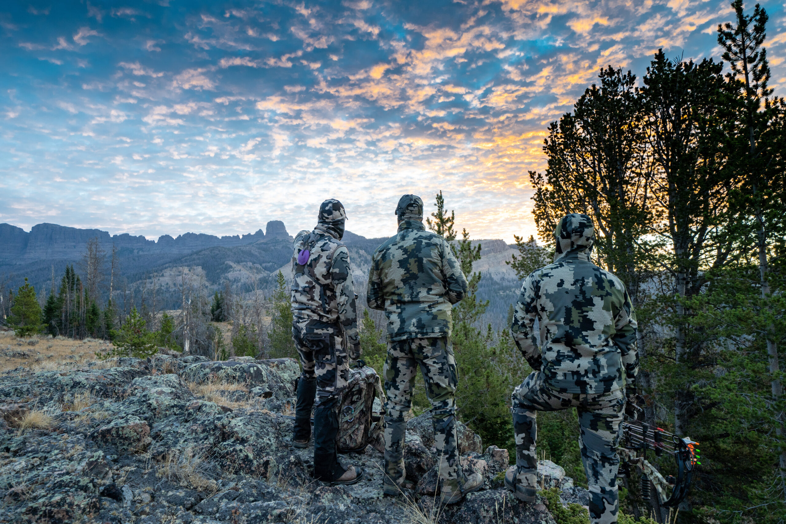 Three elk hunters look for elk.