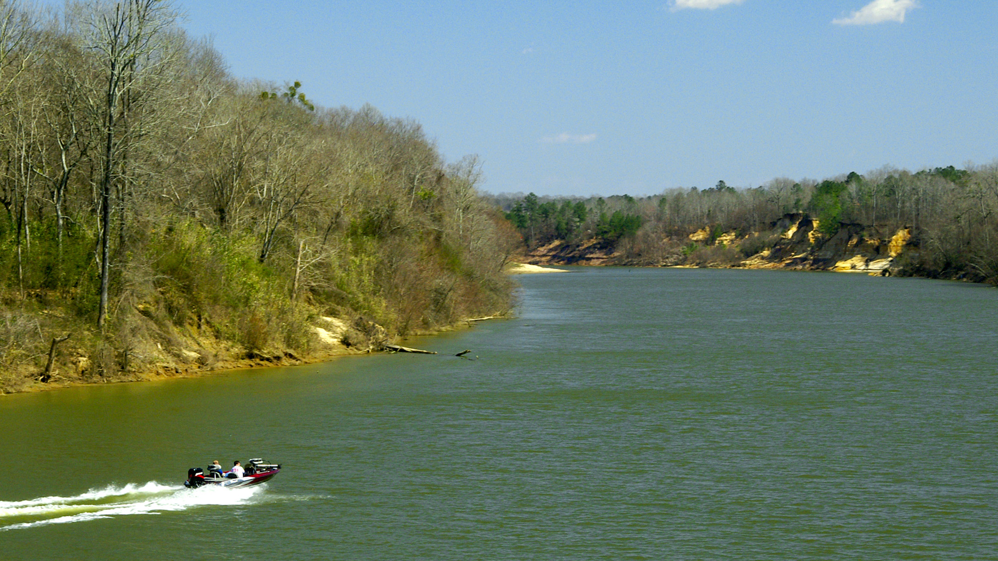 fishing boat on river in early spring