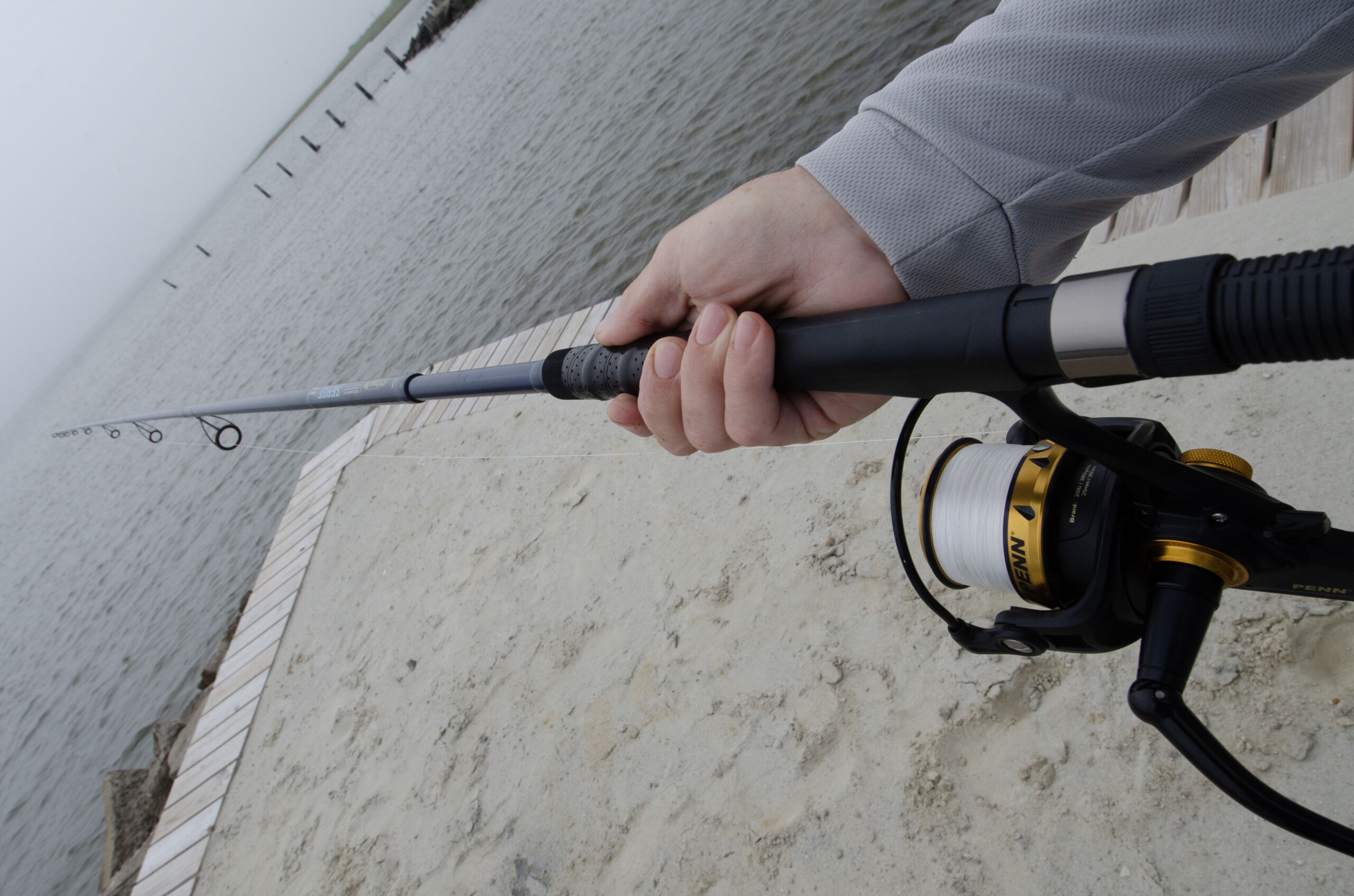 Angler holds a St. Croix surf fishing rod.