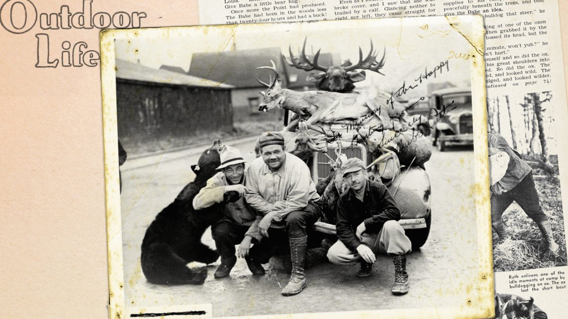 Babe Ruth poses with two other hunters and various dead game animals.