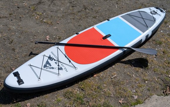 ROC Polar Outdoors paddle board sitting on sand