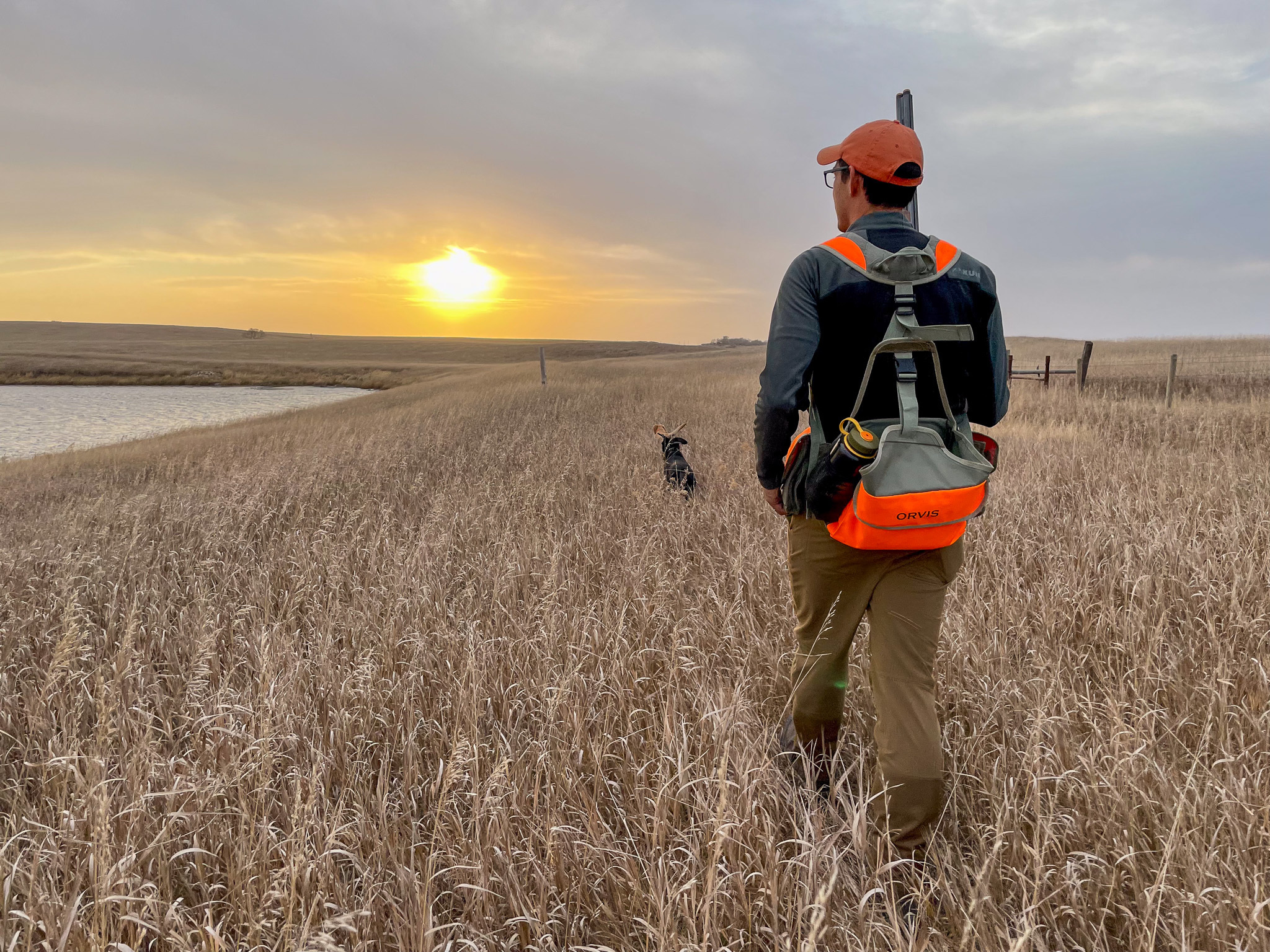 A hunter tests an upland vests in a pheasant field.