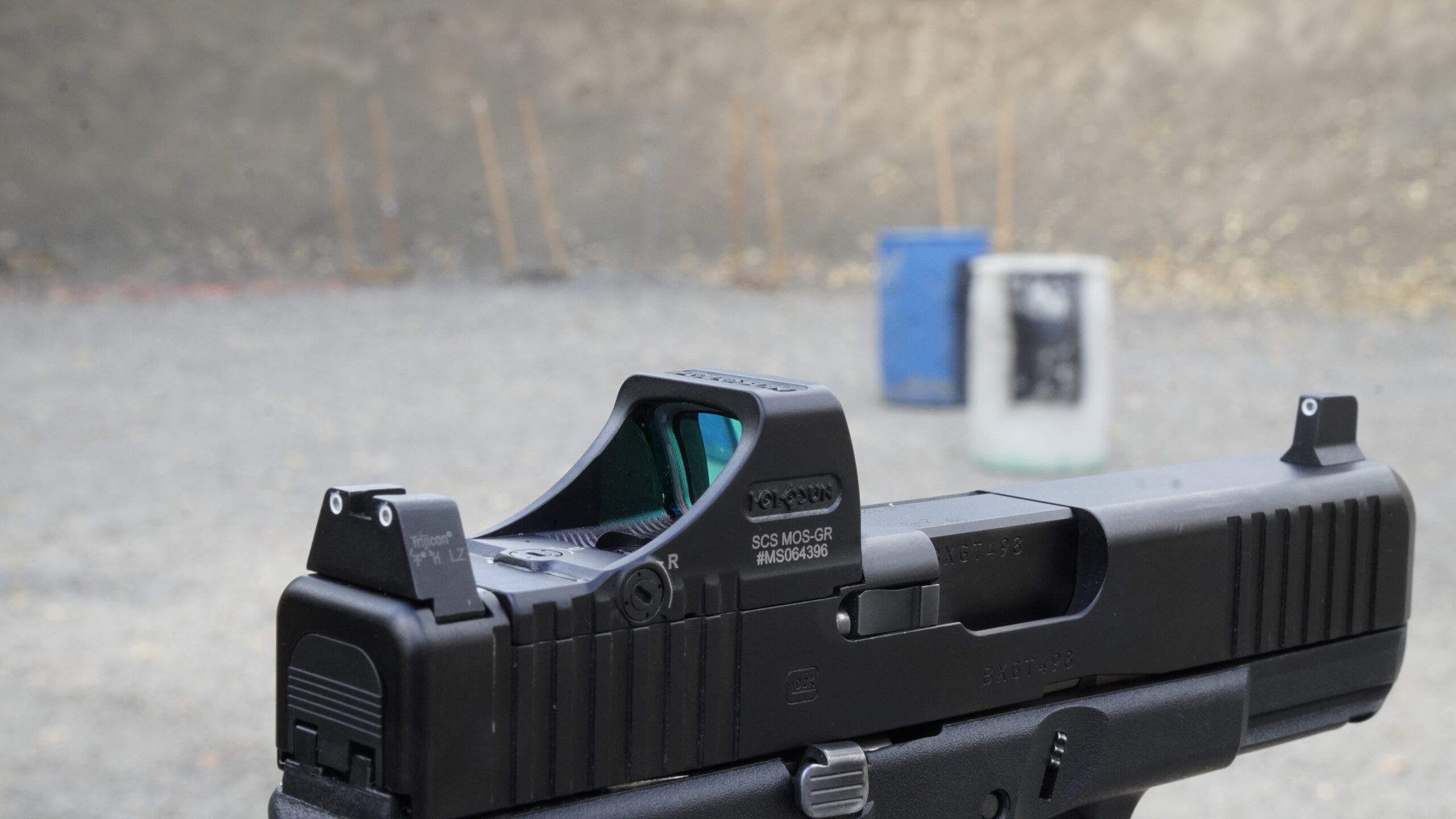 Co-witnessed glock sights combined with a red dot.