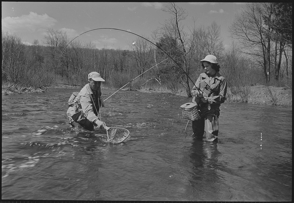 Black and white photo of fly fishing.