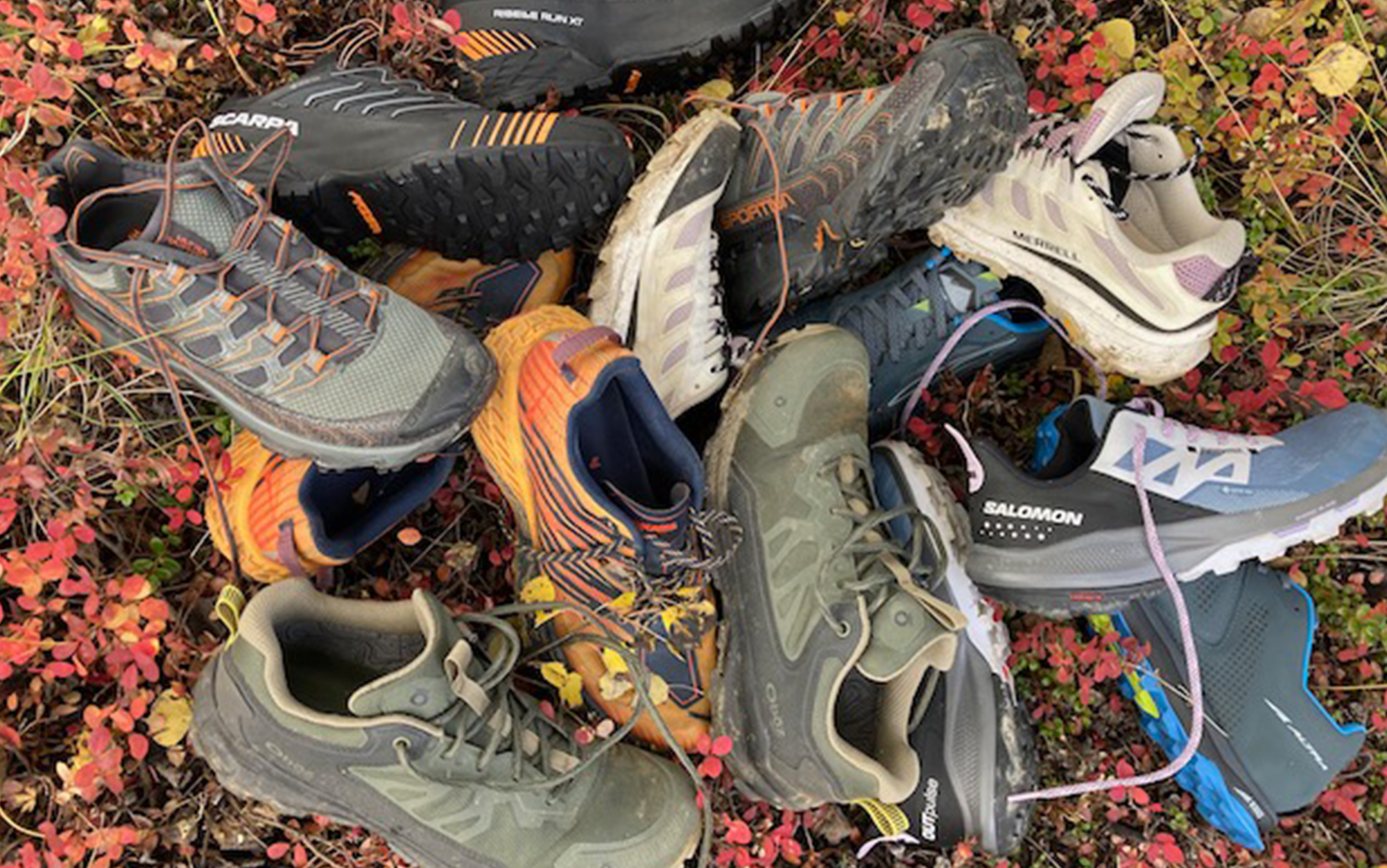 The best lihgtweight hiking shoes sit in a pile.