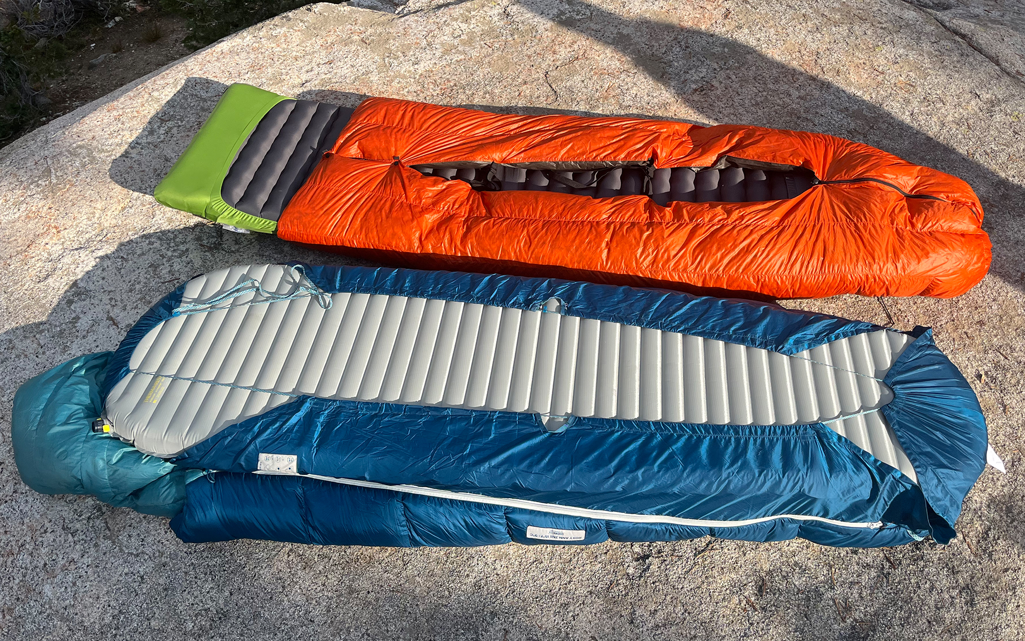 The Big Agnes Roxy's attached sheet (bottom) cinches to your sleeping pad. It's works a little different than other popular quilts (top).