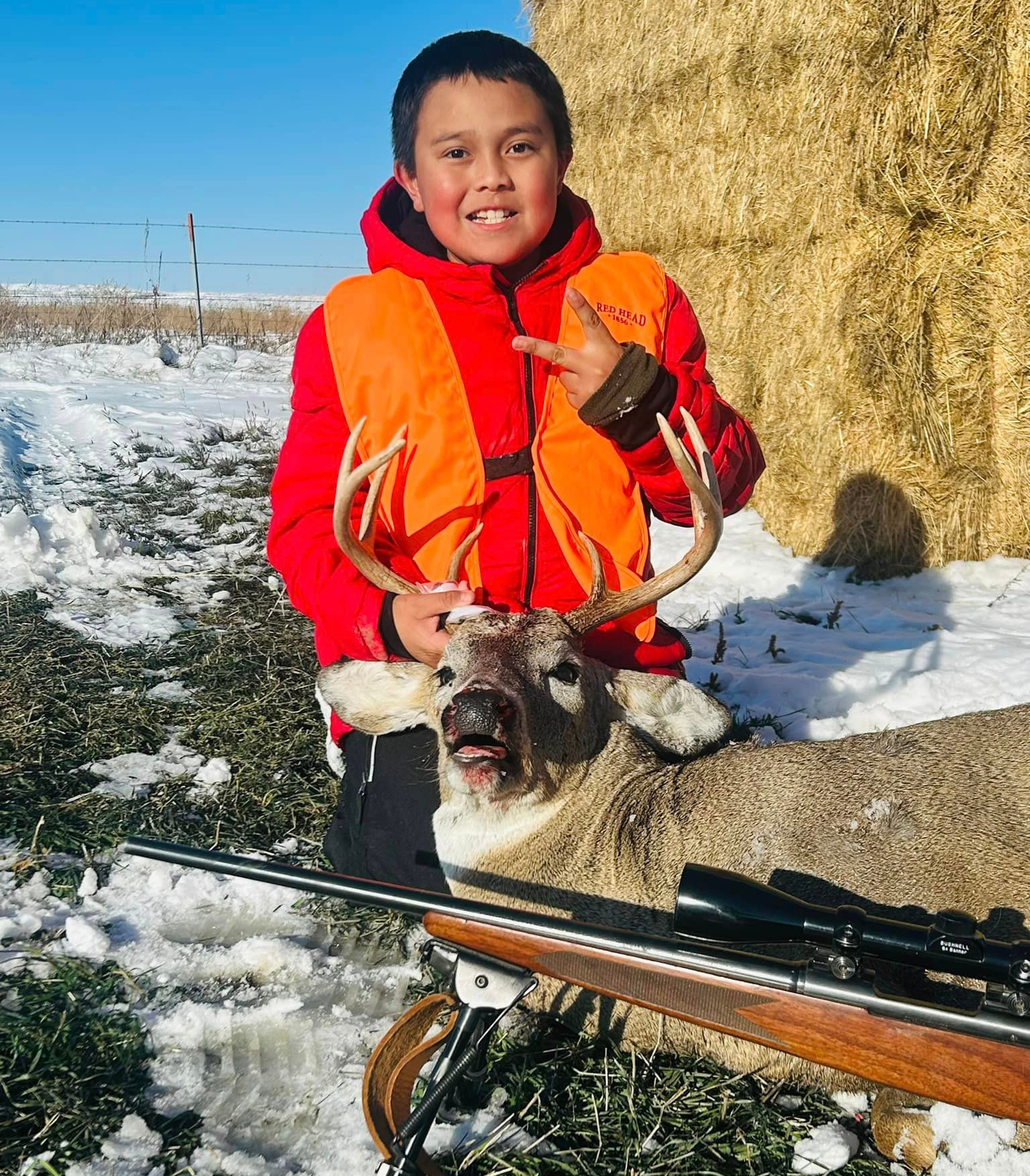 Zayden with his whitetail buck
