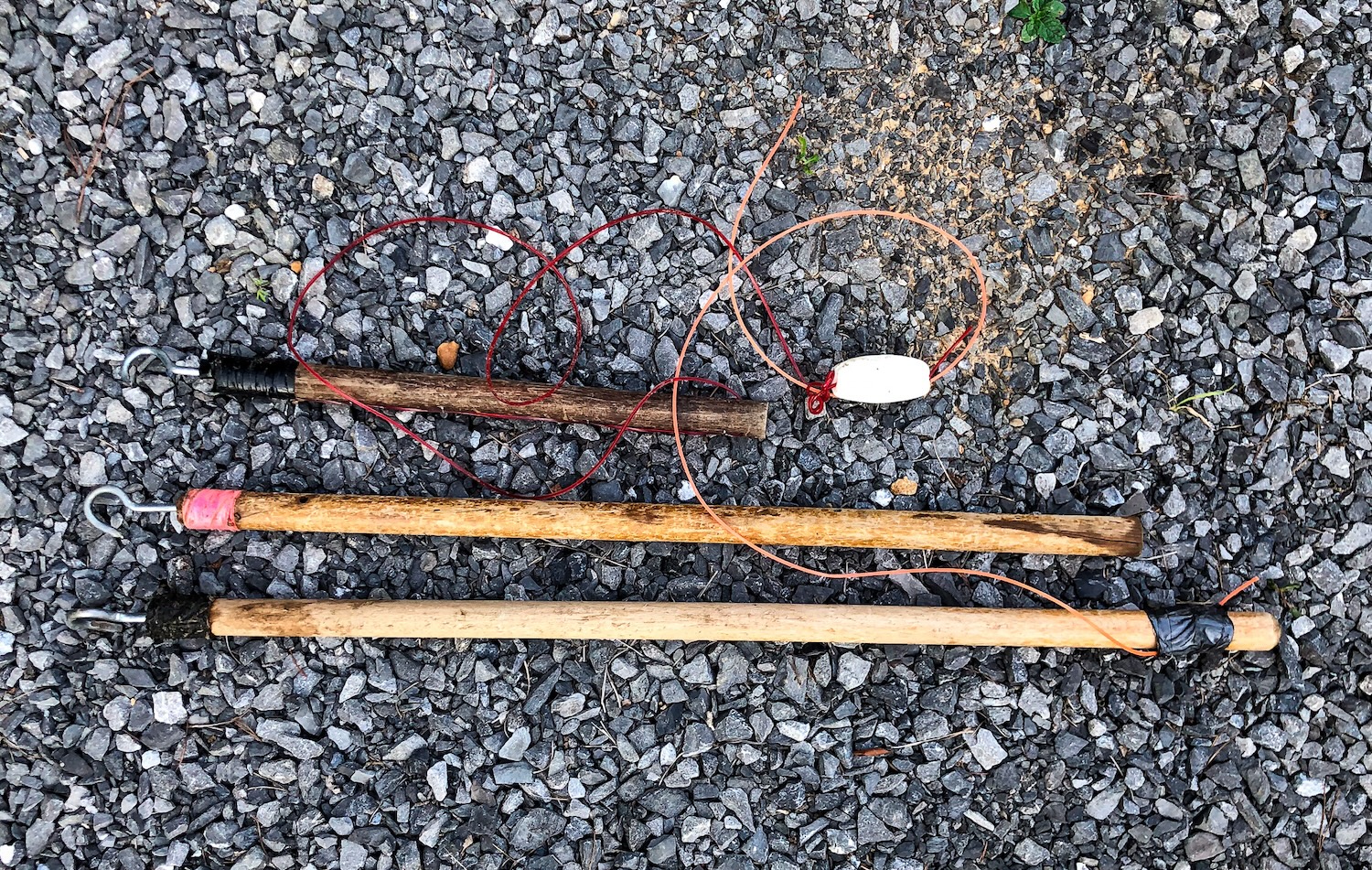 Three noodling sticks of different lengths.
