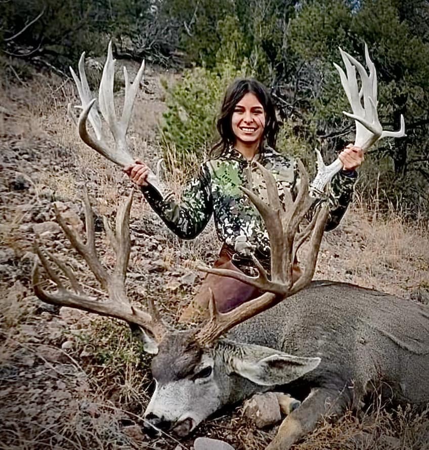 Lopez with sheds and a giant deer.