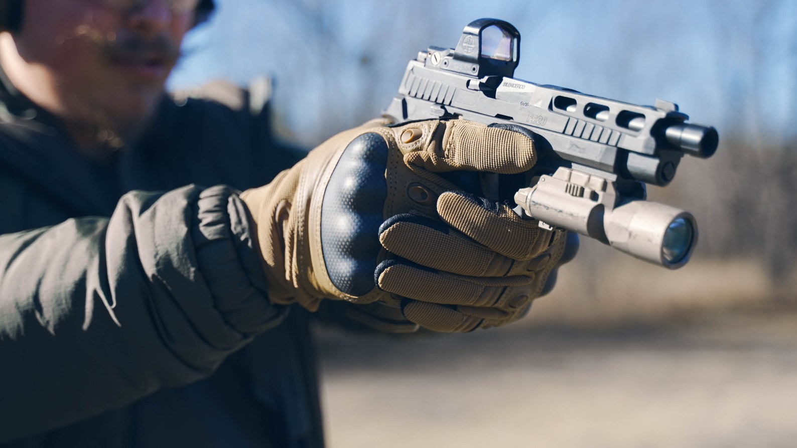 The author tested the best tactical gloves while shooting handguns and rifles.