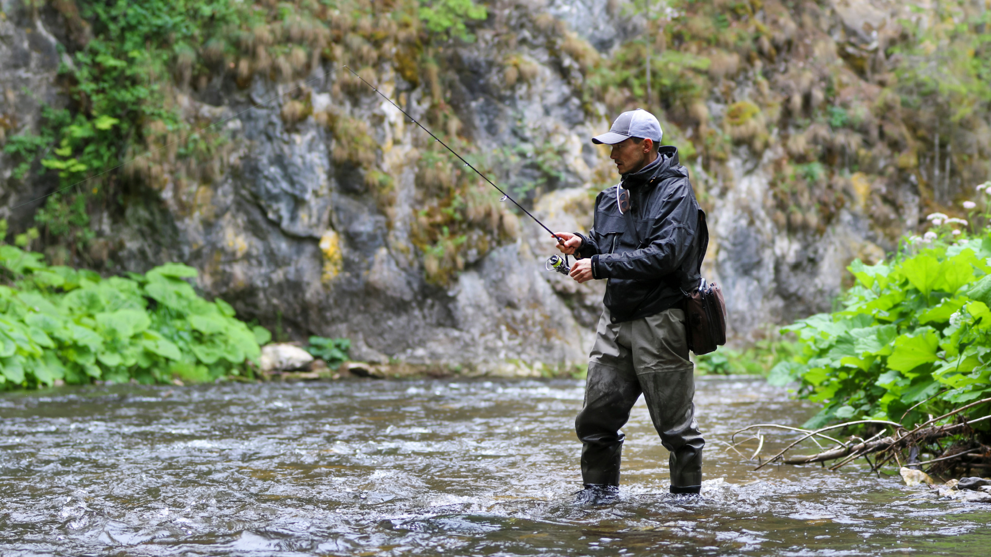 man fishing in waterproof gear