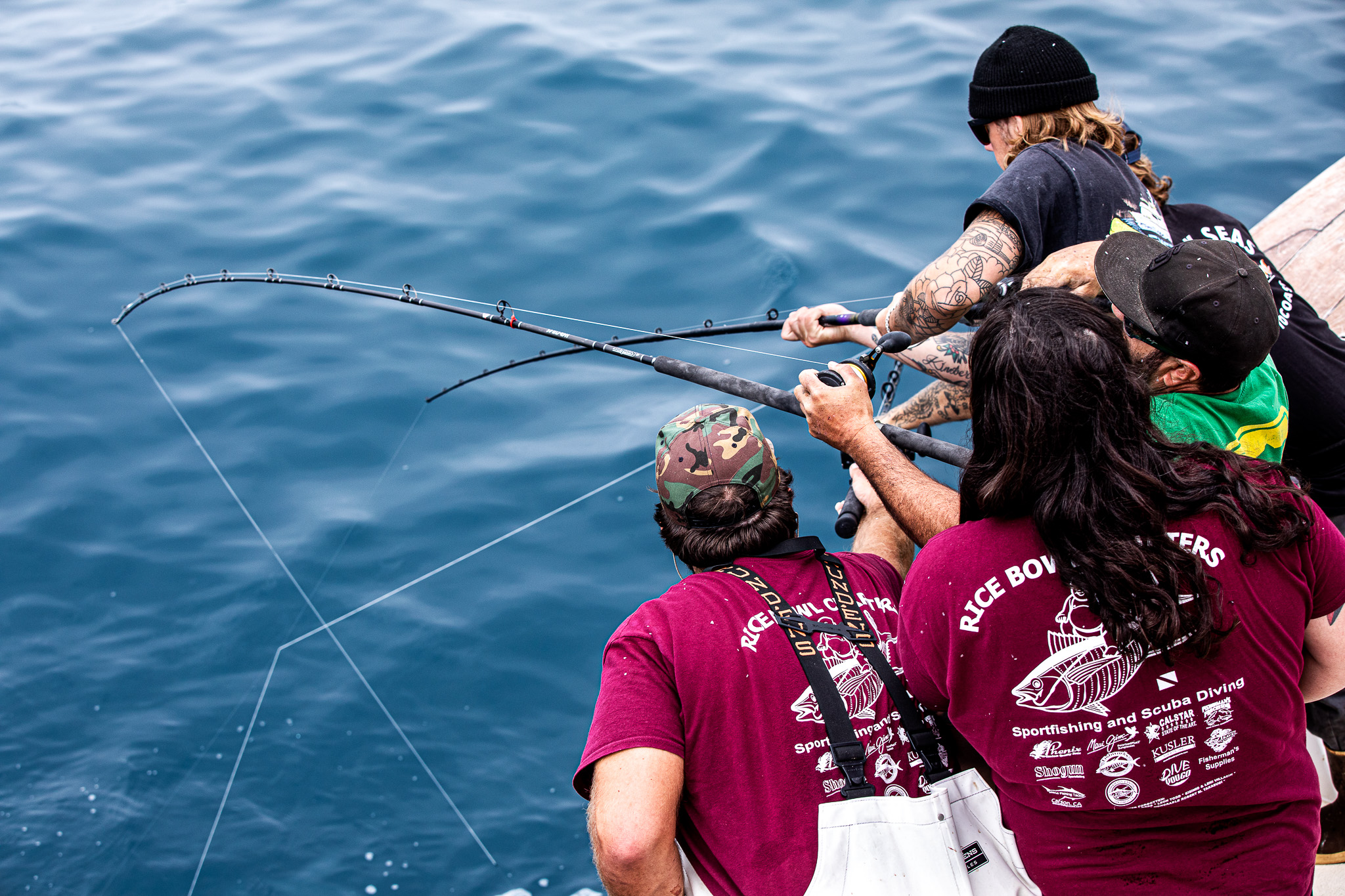 Deckhands help clients avoid tangling their lines.