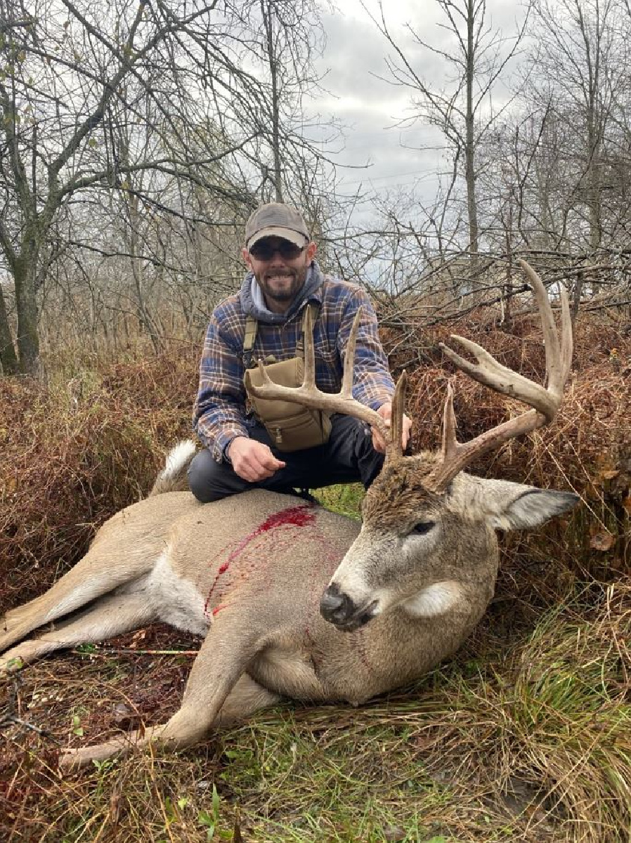 Jayson Zorda poses with a mature whitetail buck he poached.