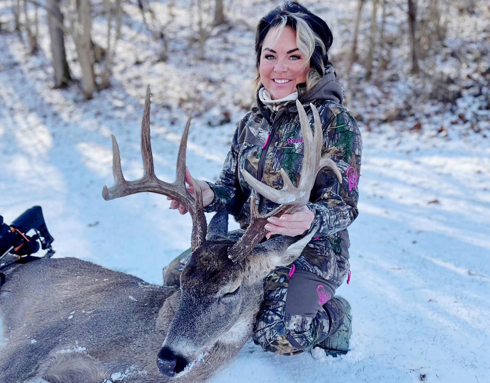 A crossbow hunter poses with an 11-point buck tagged in Ohio.