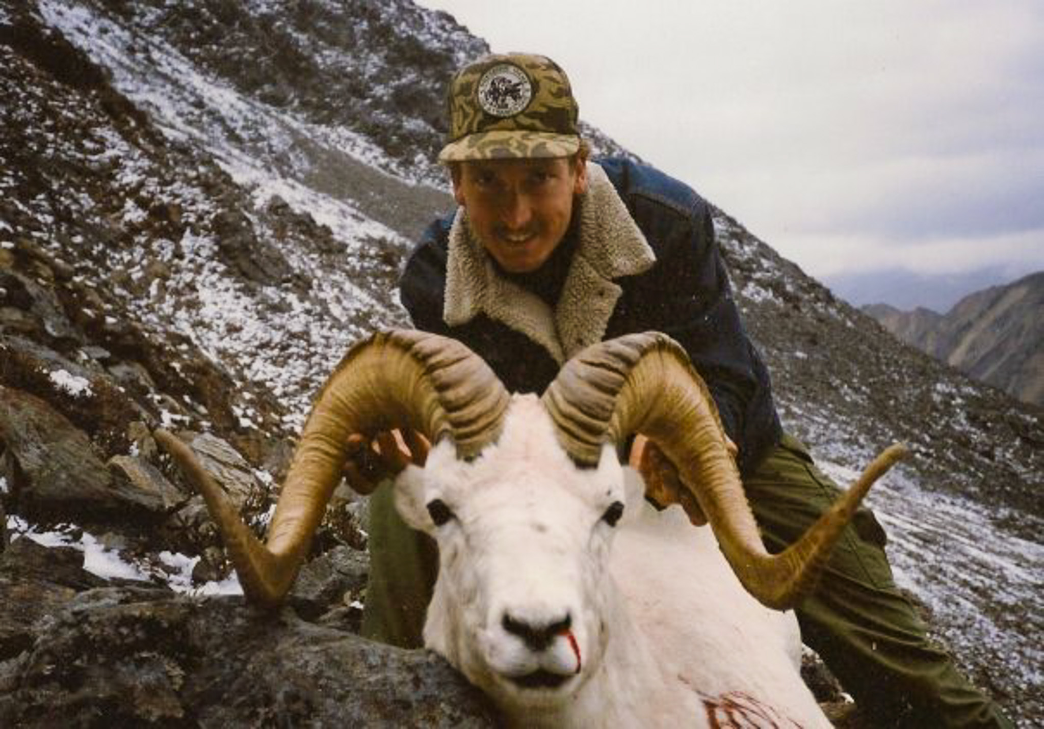 A vintage photo of a 1990s-era Alaska guide with a Dall ram.
