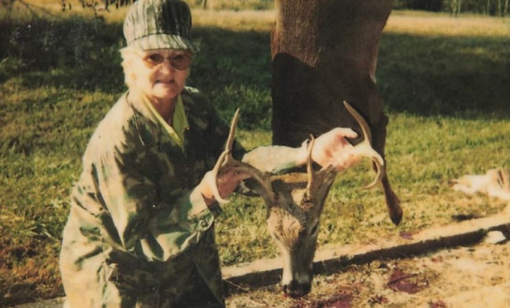 Charleen Parten poses with a whitetail buck.