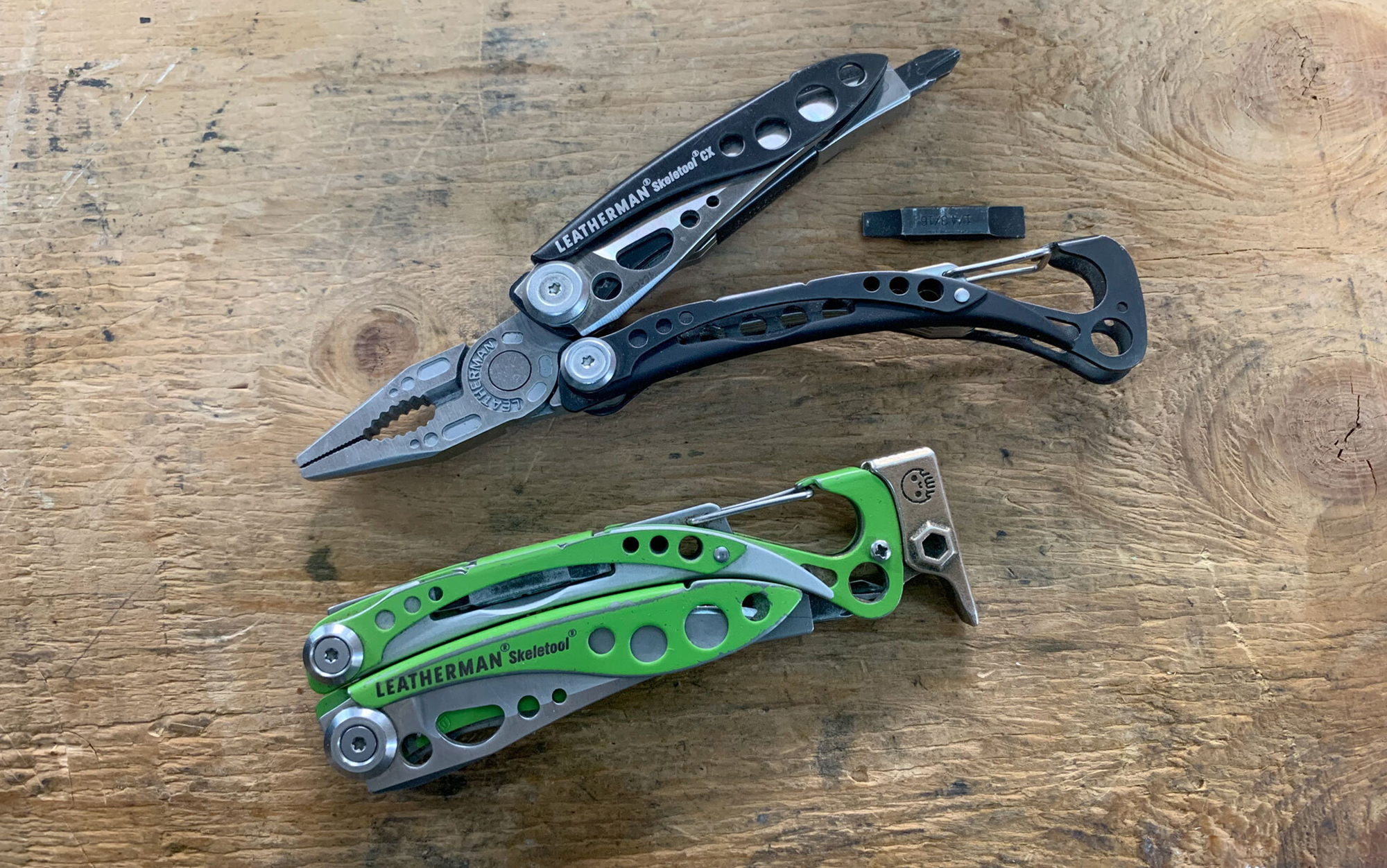 The Leatherman Skeletool CX features a knife blade, needlenose/regular combo pliers with wire cutters, flat bit driver, extra bit storage in handle, and bottle opener.