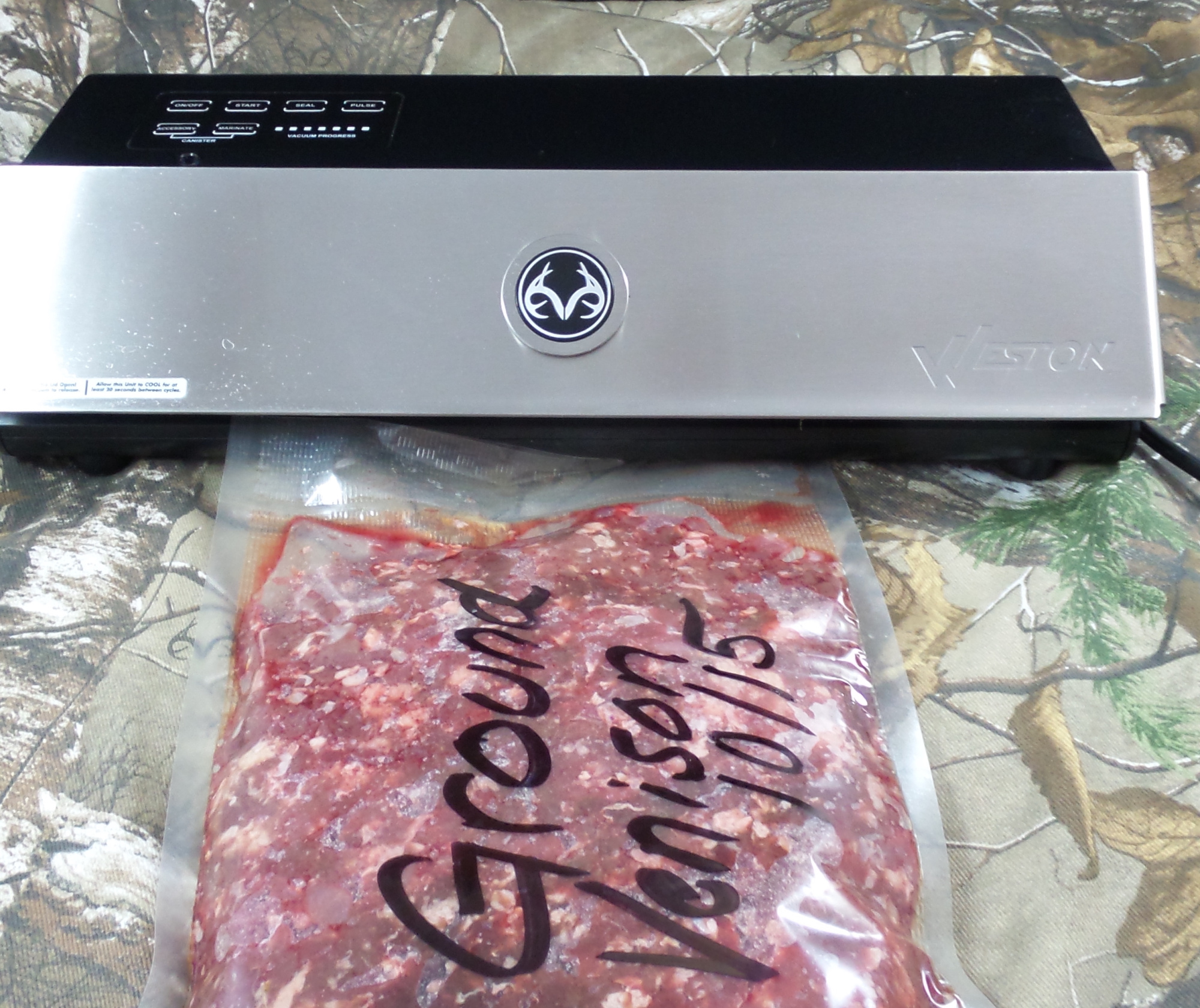 An external suction vacuum sealer makes a flat package of ground venison.