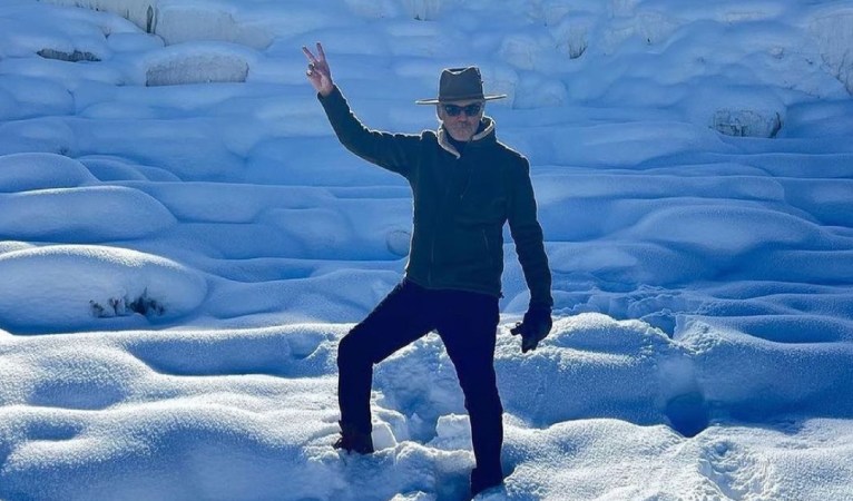 Pierce Brosnan poses for a photograph in Yellowstone National Park.