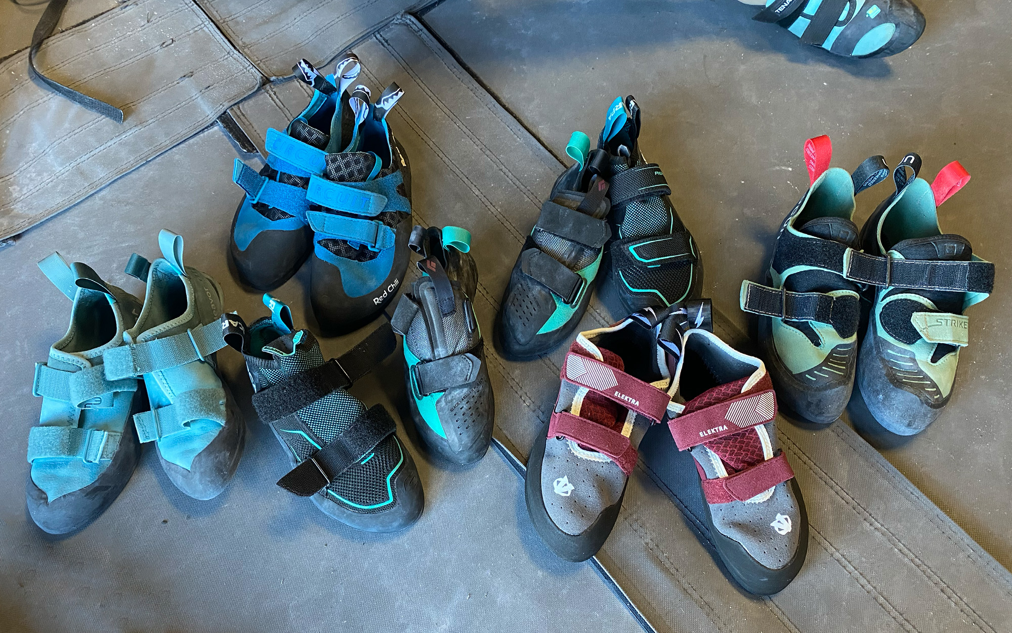 The best beginner climbing shoes sit in a pile.