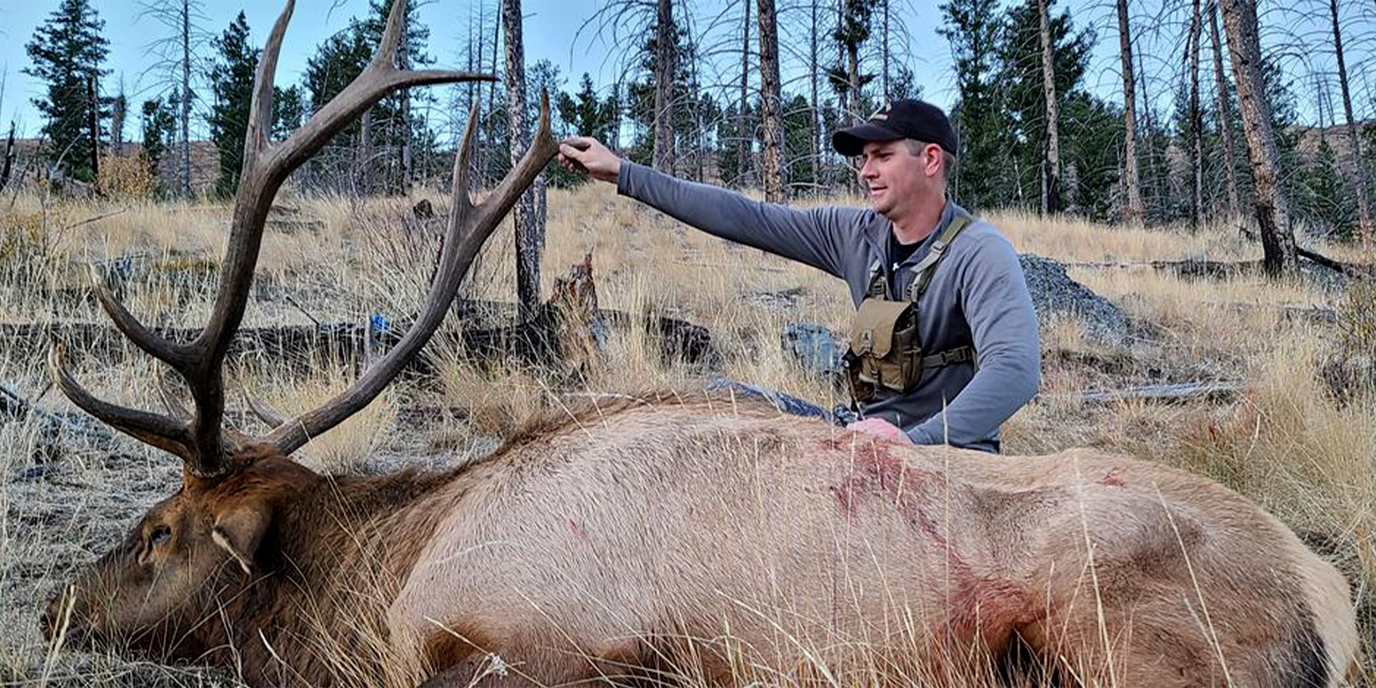 An Idaho hunter with a bull elk.
