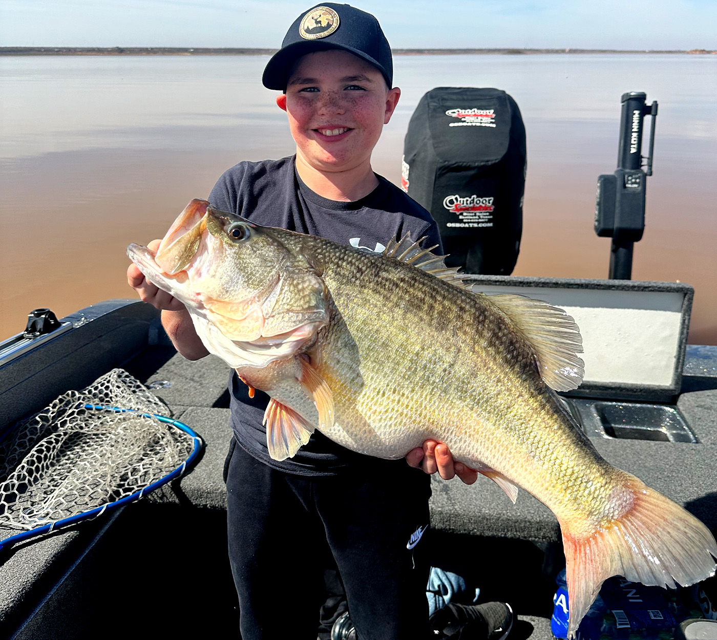 A young angler holds up a huge Texas largemouth.