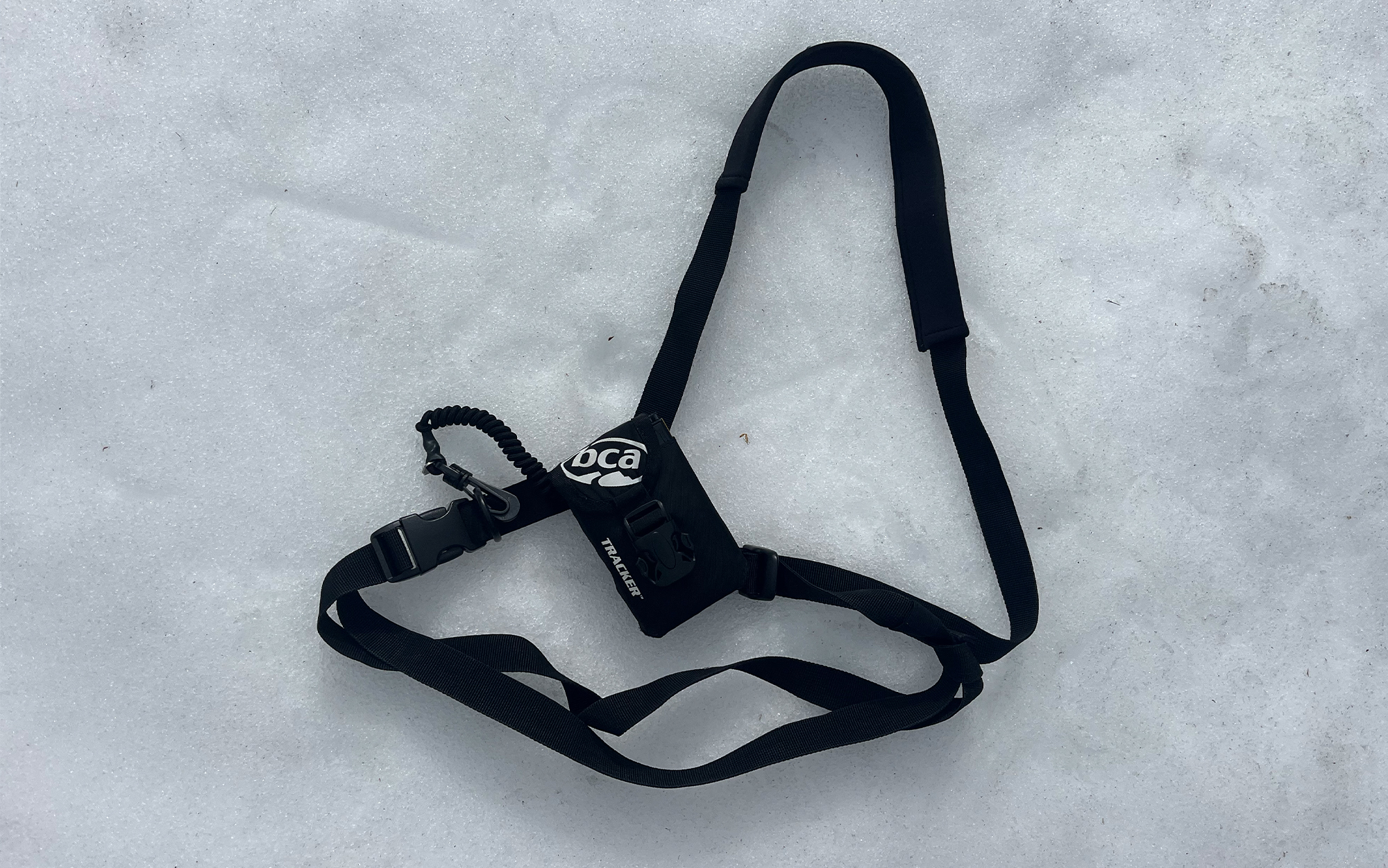 The BCA Tracker 3 harness sits in the snow.