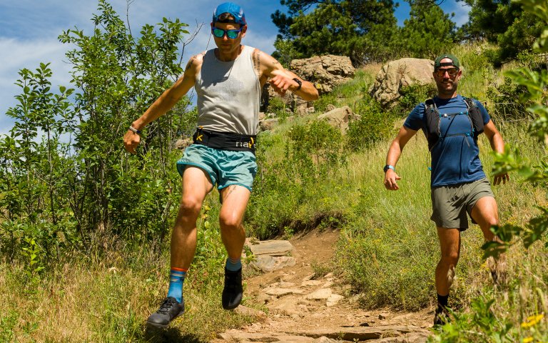 Men trail running in barefoot shoes