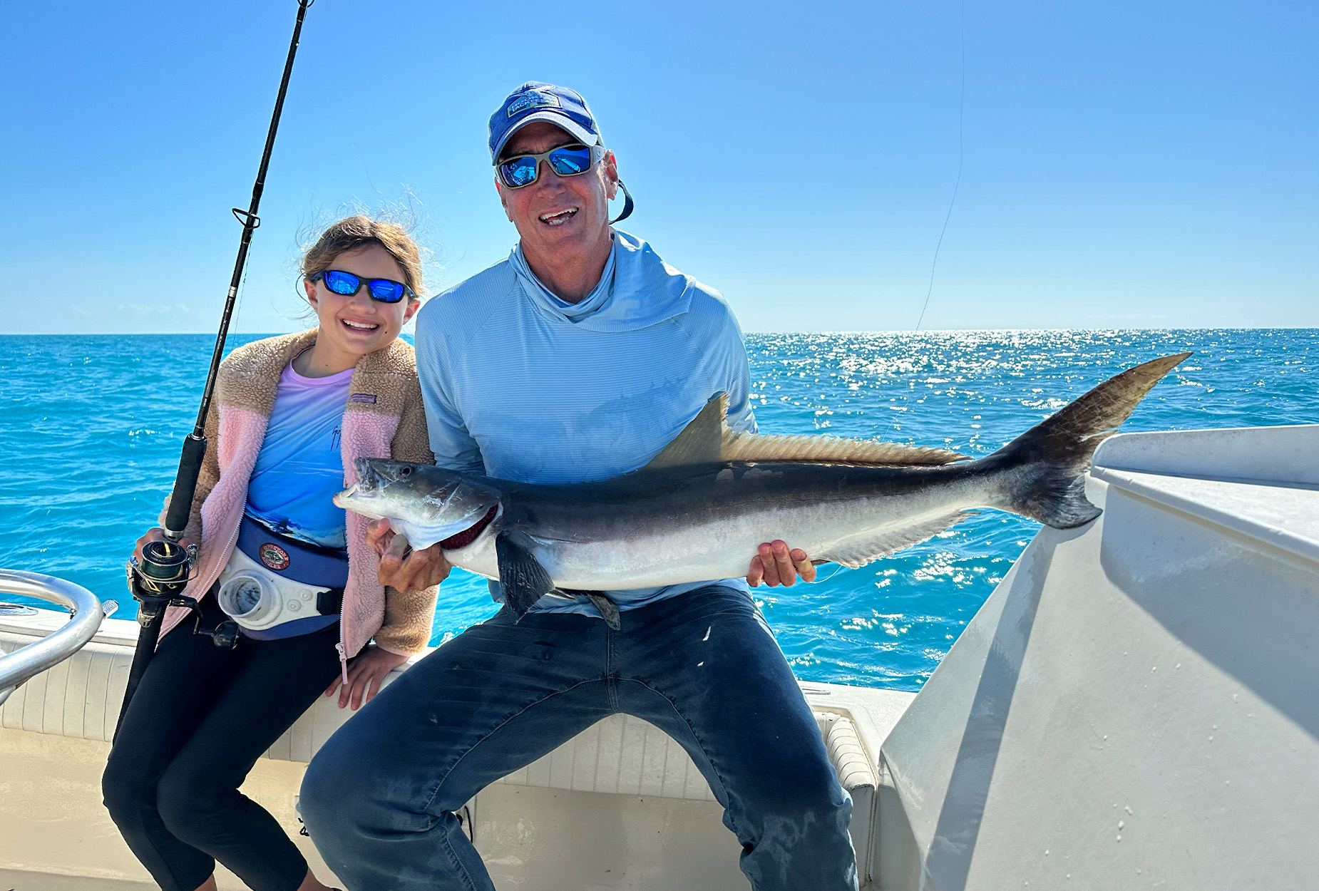 Two anglers with a new youth state-record cobia.
