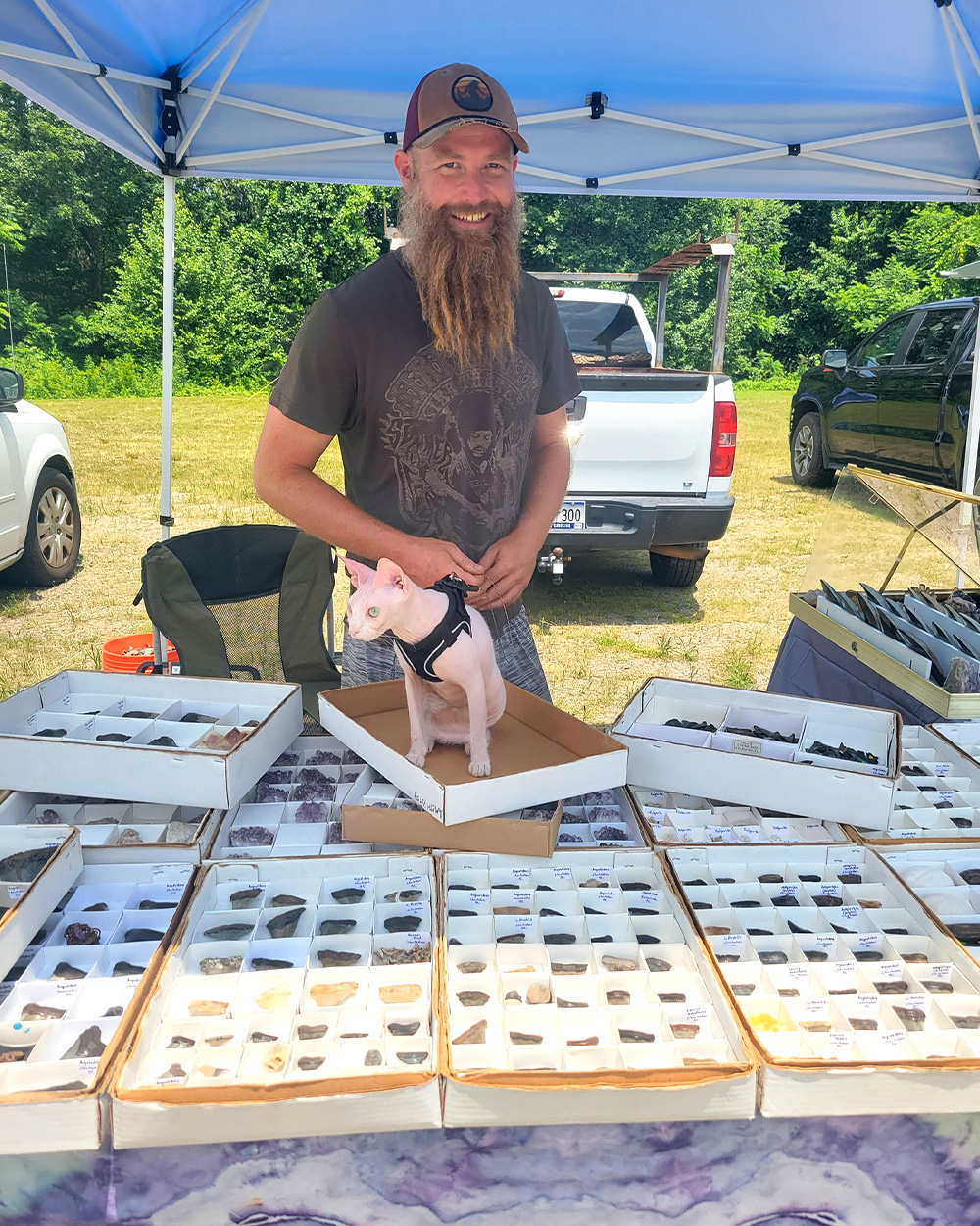 A fossil hunter sells fossilized shark's teeth at a booth.