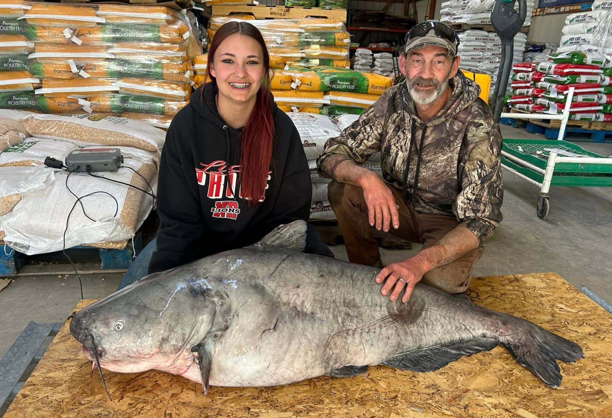 Jaylynn and Chuck Parker with a blue catfish.