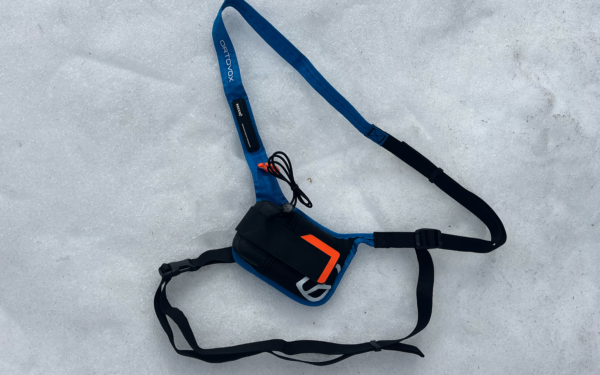 Ortovox Diract Voice harness sits in the snow.