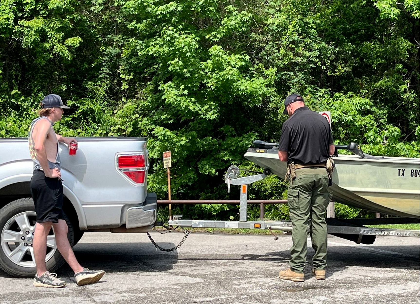 A Texas game warden inspects a boat.