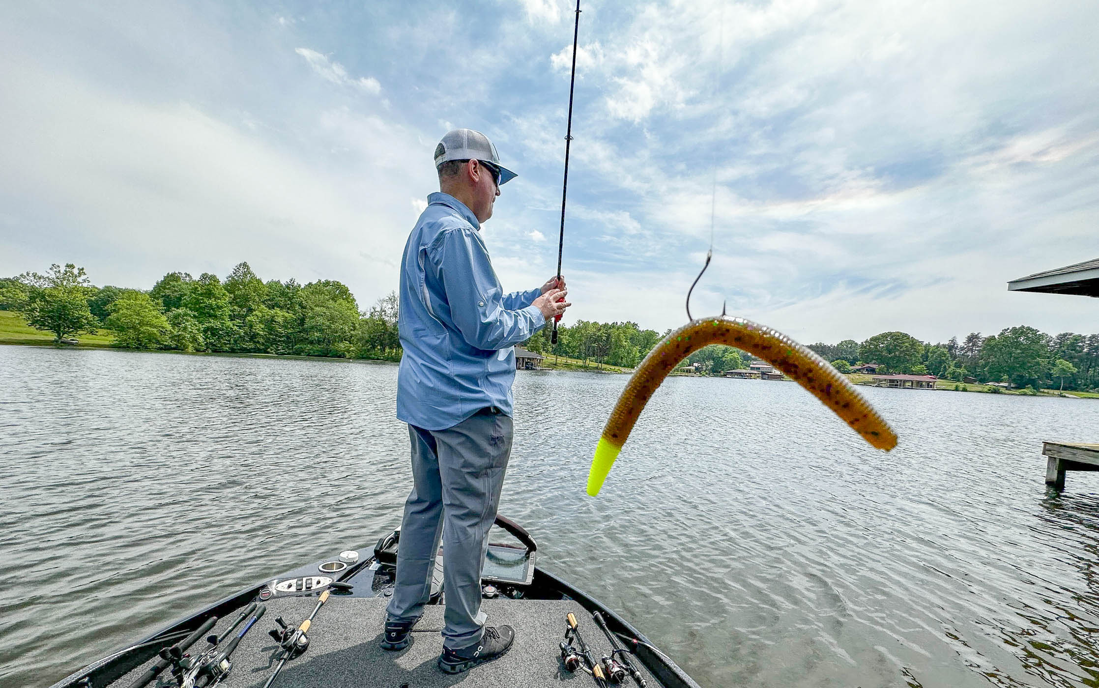 An angler preparing to cast a wacky rig.
